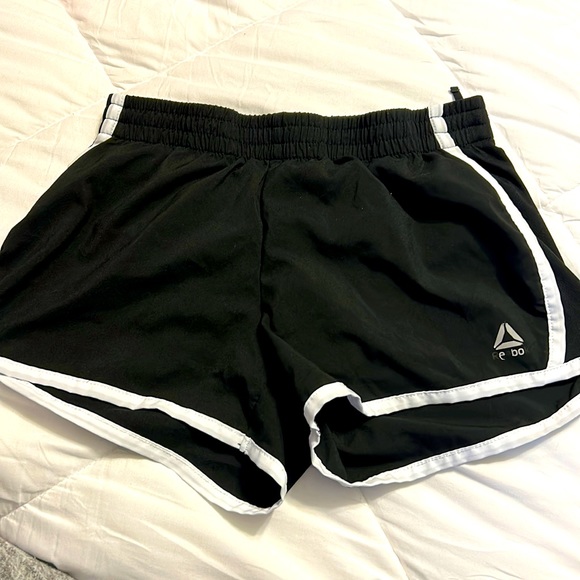 A pair of black running shorts. Has string ties inside. - Picture 1 of 2